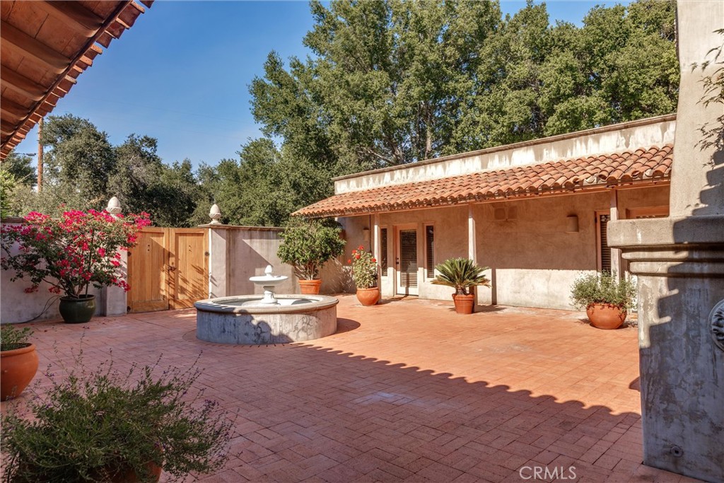 3595 West Oak Trail Road Santa Ynez, CA 93460 - Photo 7 of 60 a view of a house with backyard sitting area and garden