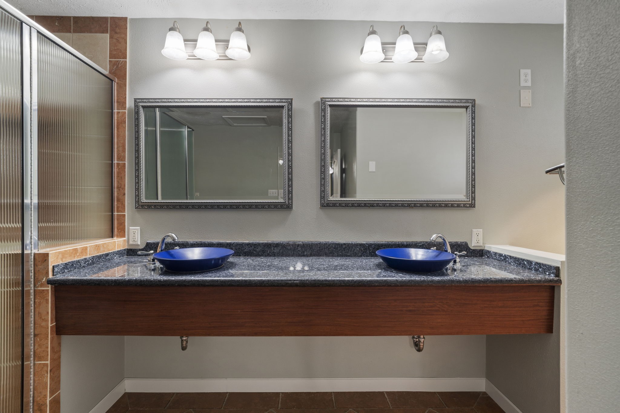6102 Redding Road Houston, TX 77036 - Photo 28 of 40 A dual vanity in the primary bath provides plenty of space for two to get ready comfortably.