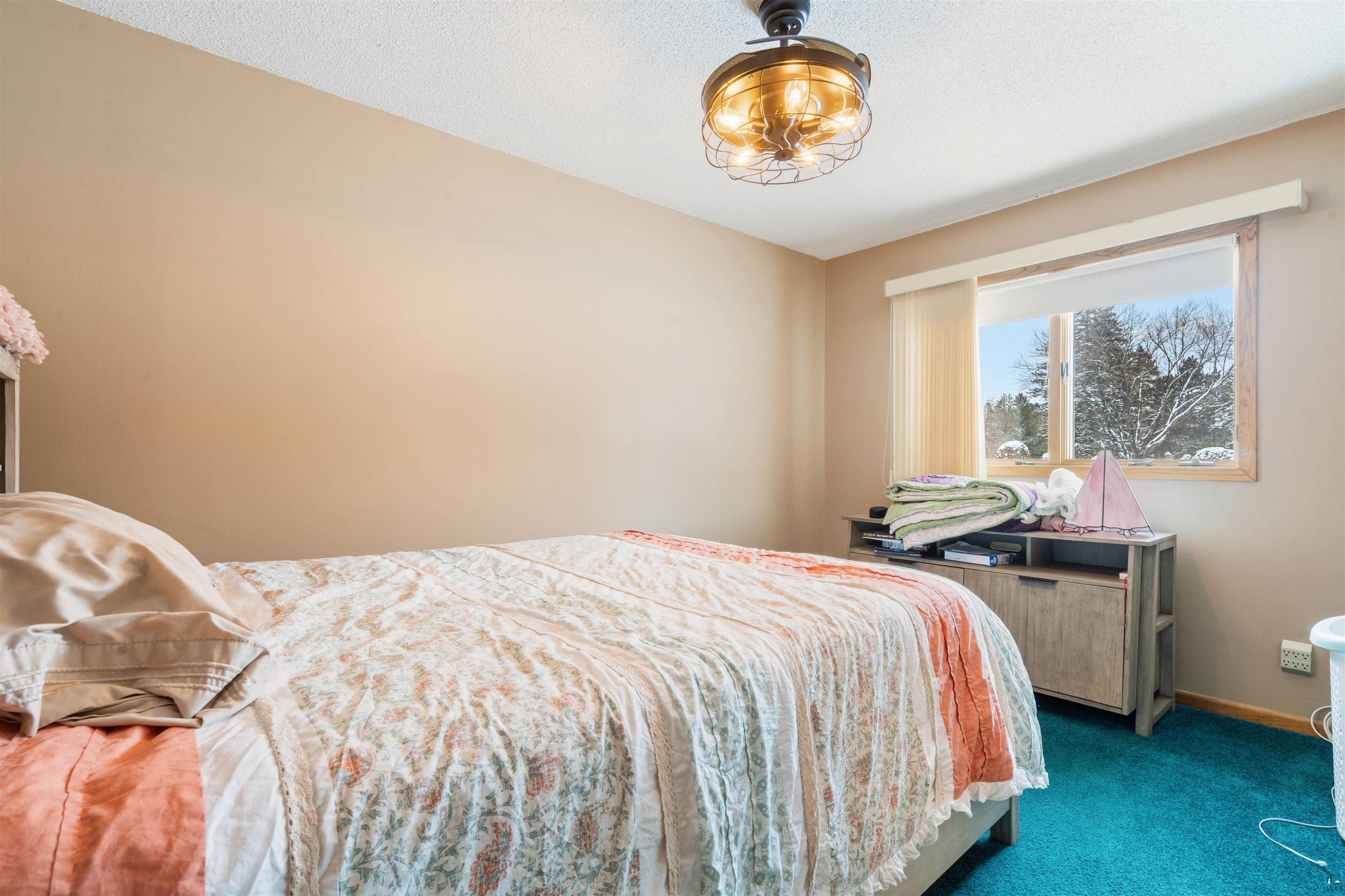1580 Olsonville Road Carlton, MN 55718 - Photo 11 of 30 Carpeted bedroom featuring baseboards