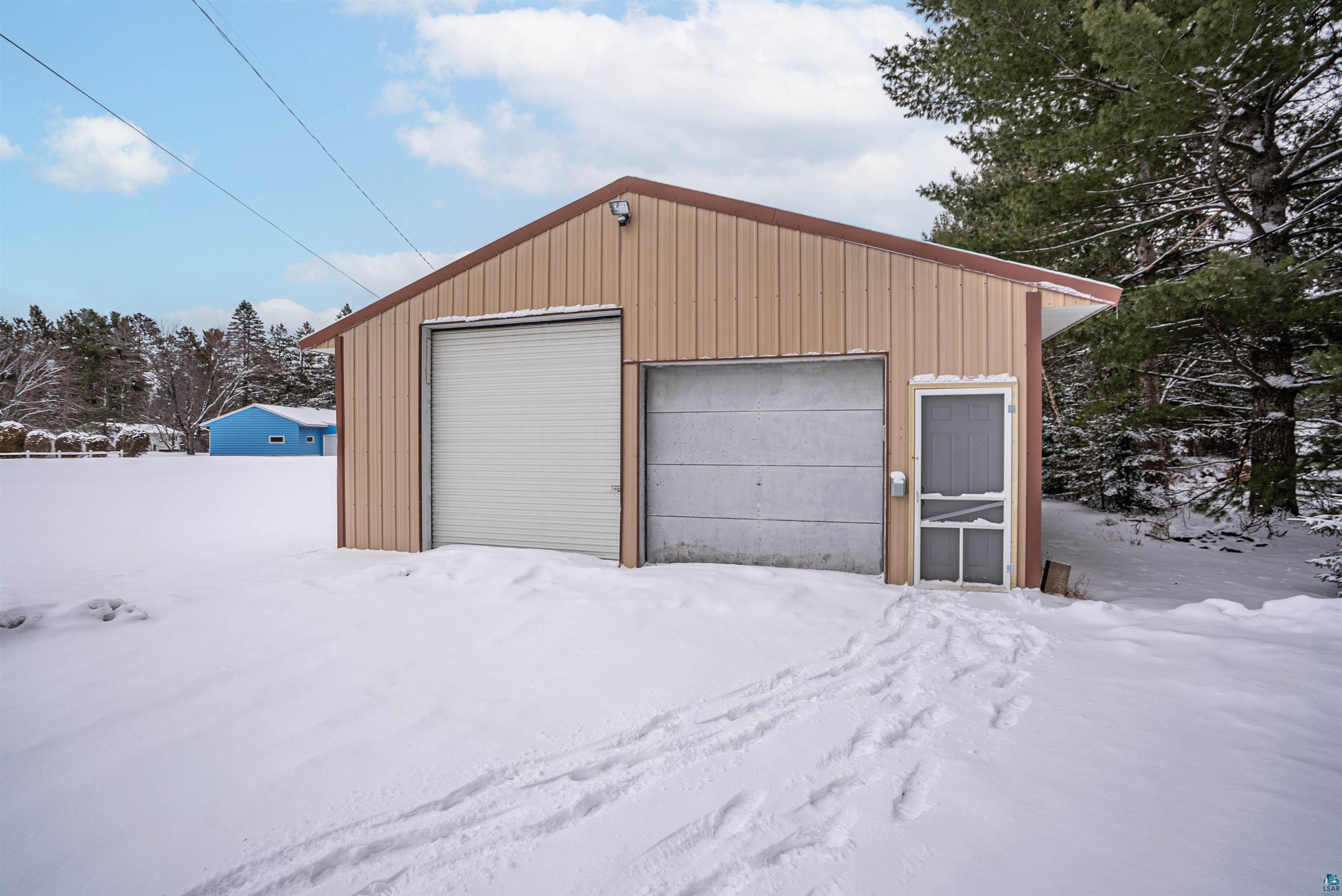 1580 Olsonville Road Carlton, MN 55718 - Photo 17 of 30 Snow covered garage with a garage