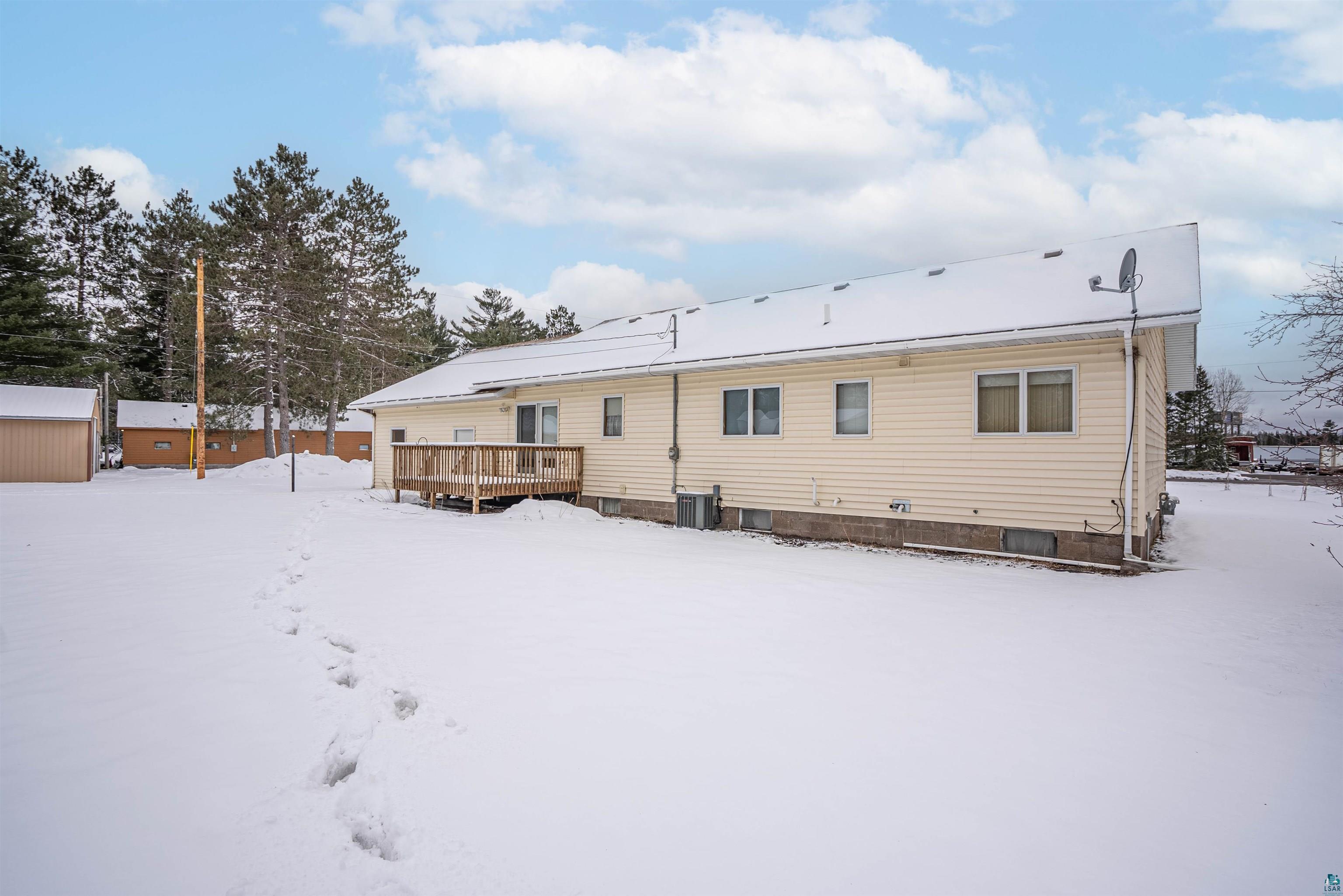 1580 Olsonville Road Carlton, MN 55718 - Photo 25 of 30 Snow covered back of property with a wooden deck