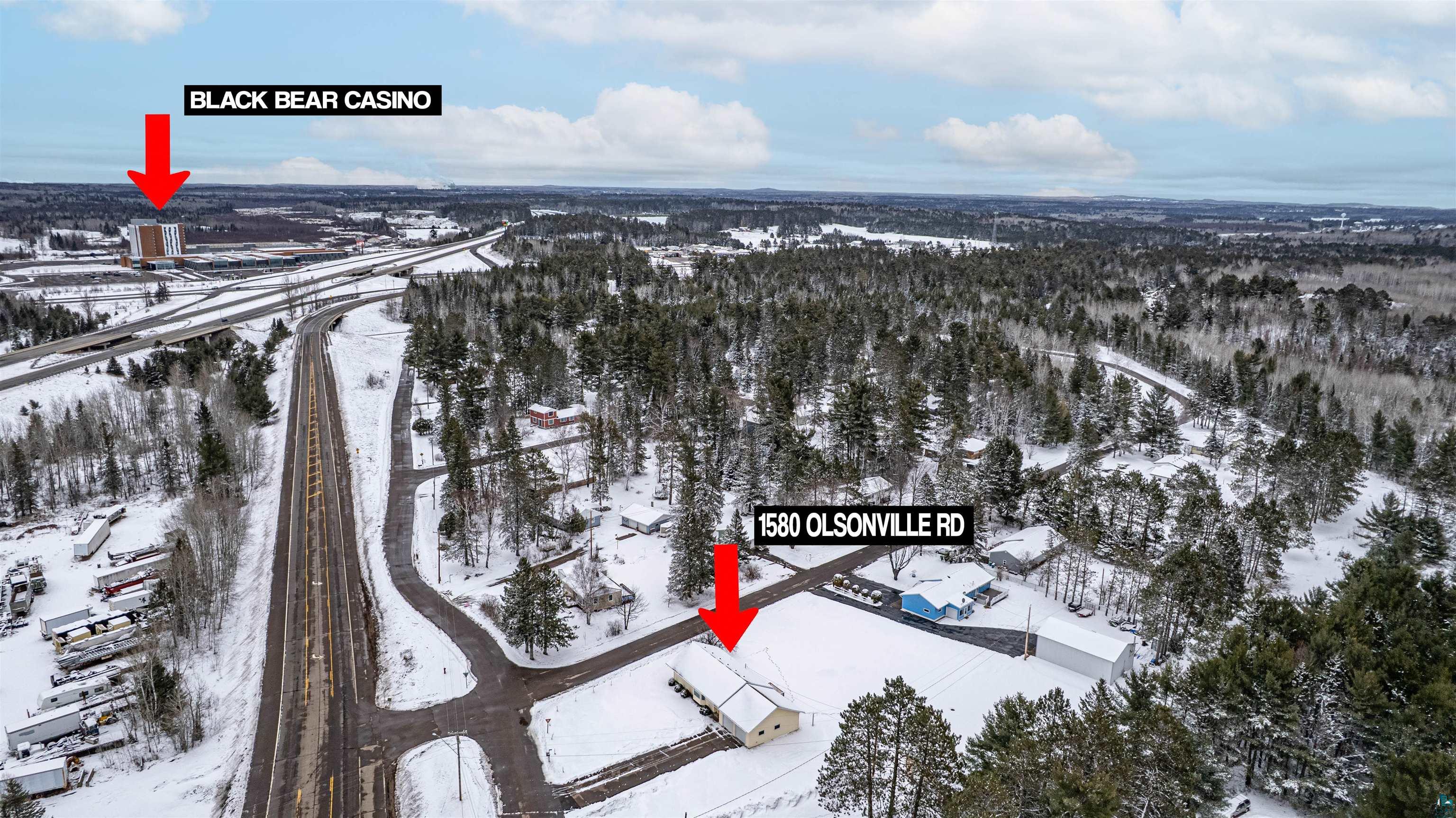 1580 Olsonville Road Carlton, MN 55718 - Photo 26 of 30 Snowy aerial view featuring a wooded view