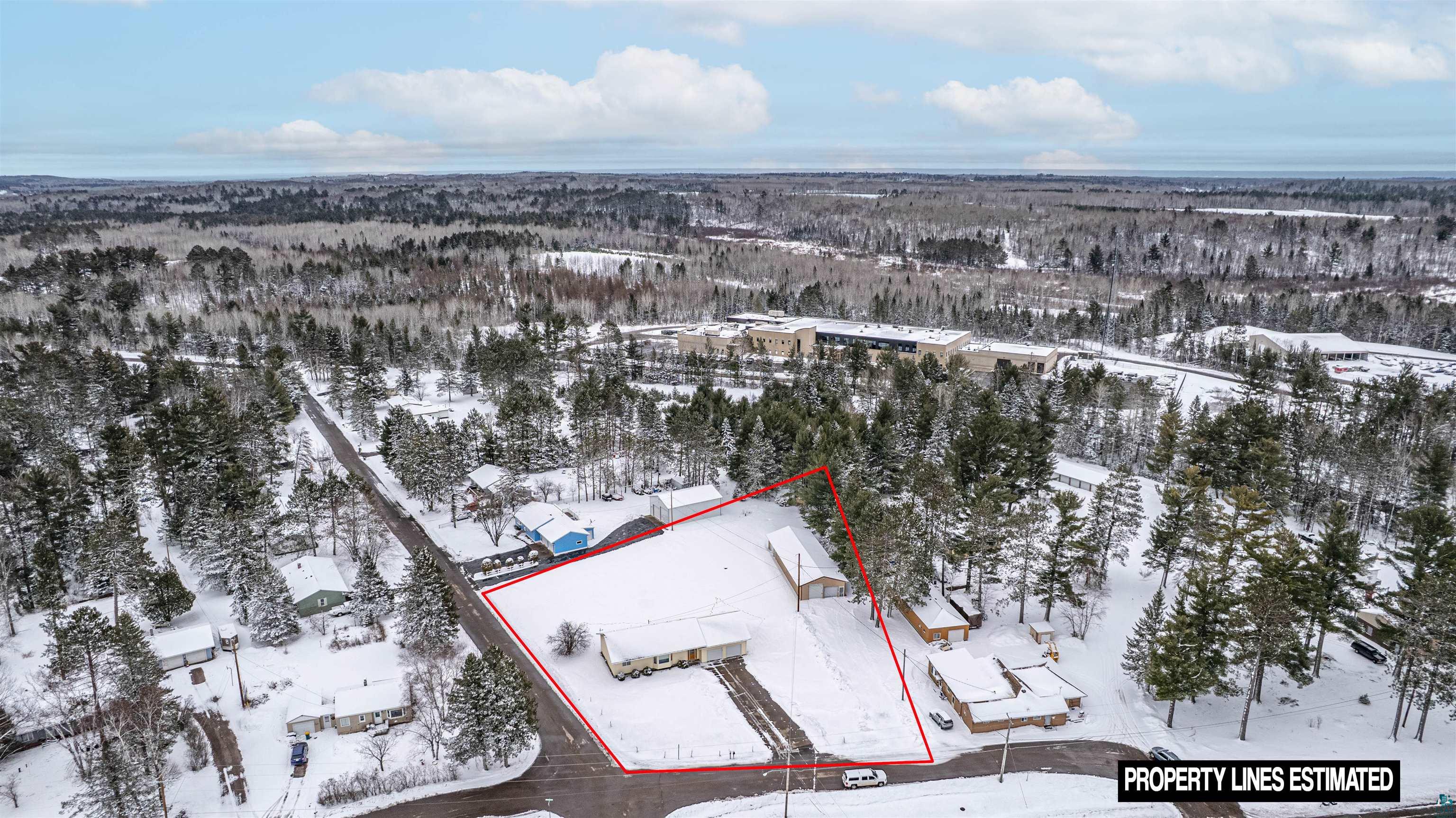 1580 Olsonville Road Carlton, MN 55718 - Photo 3 of 30 Snowy aerial view featuring property parcel outlined and a forest view