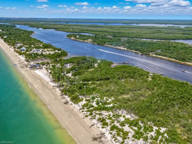 a view of a floor to ceiling window and an ocean