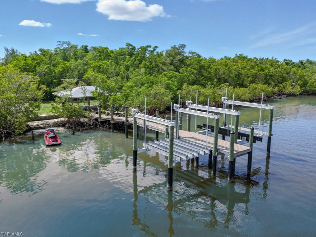 Keewaydin Naples, FL 34113 - Photo 14 of 18 a balcony with table and chairs
