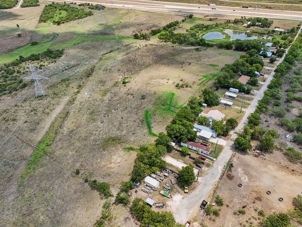 Tbd Tbd Bluebonnet Road Lockhart, TX 78644 - Photo 4 of 20 a view of a dry yard with wooden fence