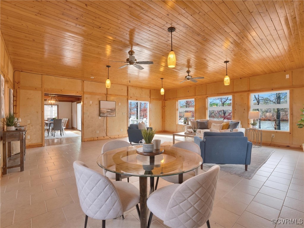 3 Lakeside Drive Columbia, VA 23038 - Photo 30 of 49 Dining room with ceiling fan, wooden walls, light