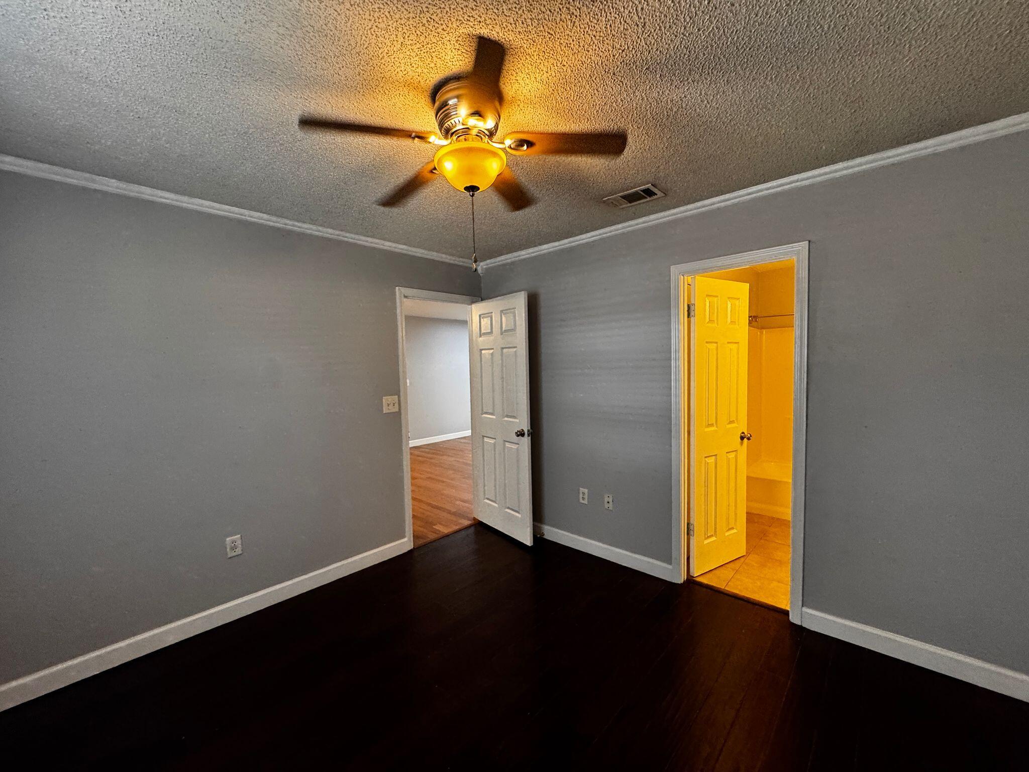 358 John King Road Crestview, FL 32539 - Photo 11 of 22 a view of an empty room with wooden floor and a window