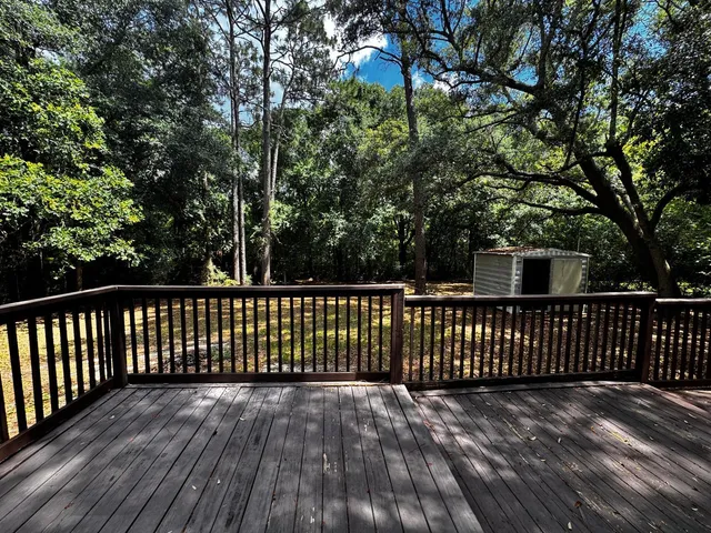 a view of deck with wooden floor and fence