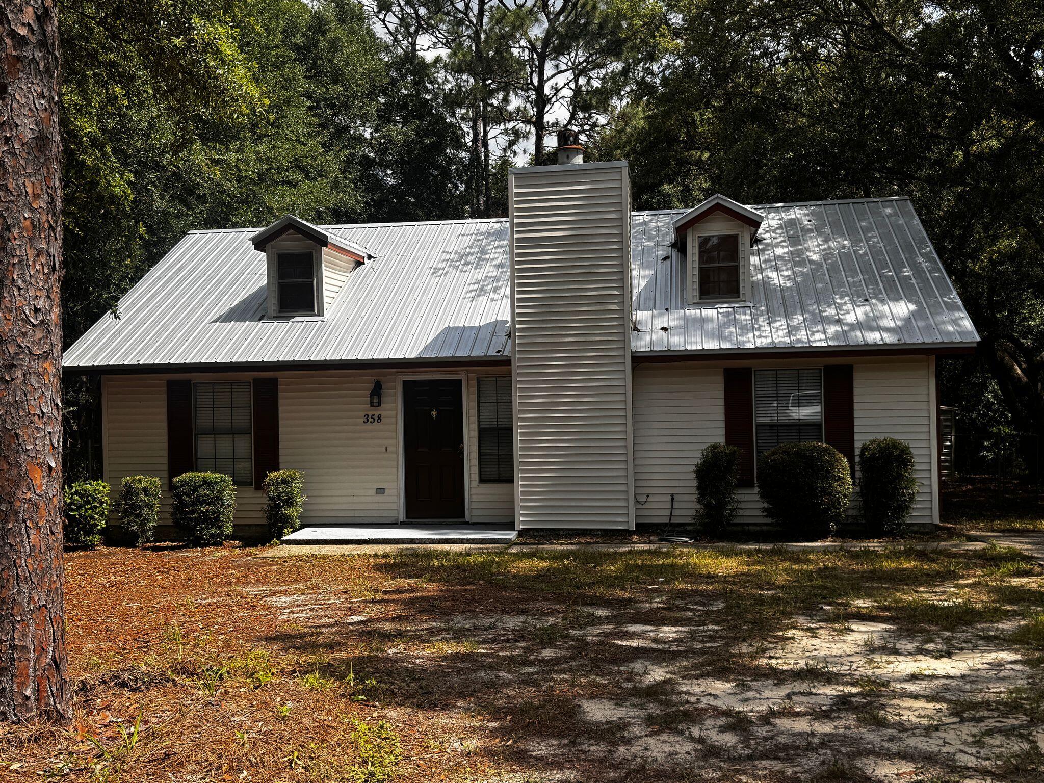358 John King Road Crestview, FL 32539 - Photo 22 of 22 a view of a house with a yard