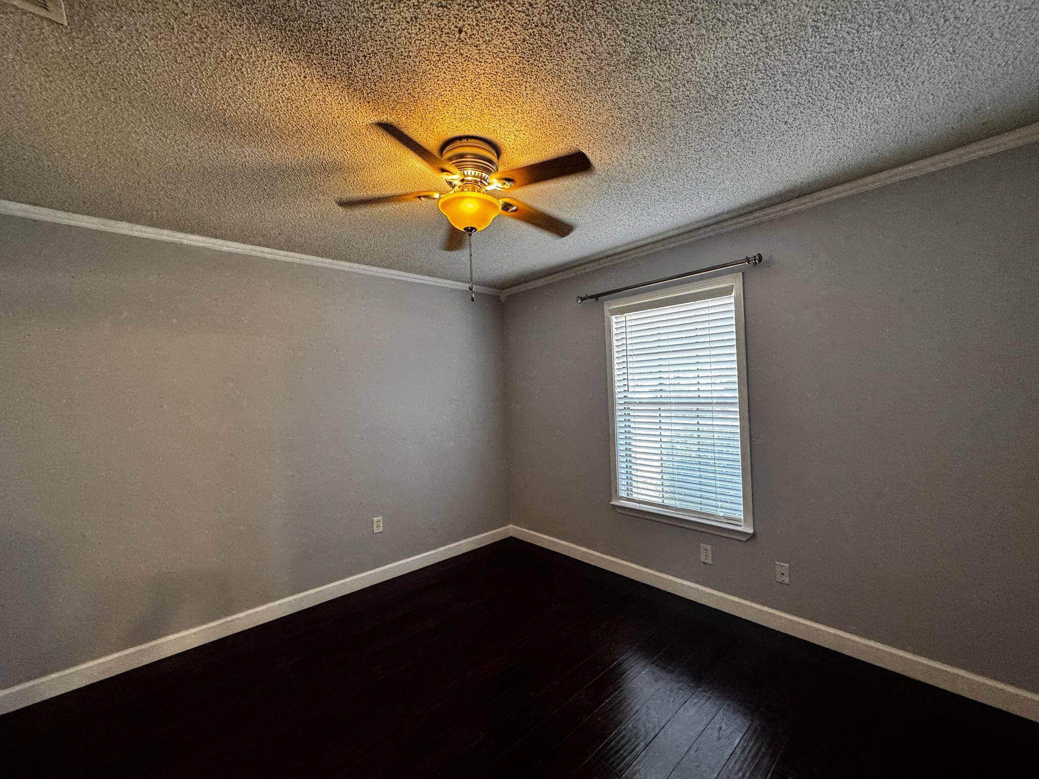 358 John King Road Crestview, FL 32539 - Photo 10 of 22 an empty room with a window and a ceiling fan