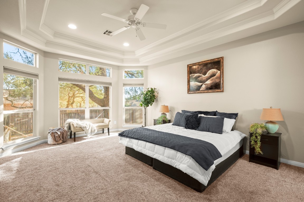8021 Tahoe Parke Circle Austin, TX 78726 - Photo 19 of 33 a bedroom with a bed painting and a large window