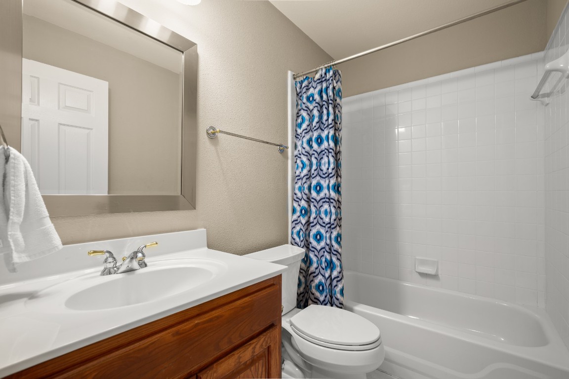 8021 Tahoe Parke Circle Austin, TX 78726 - Photo 30 of 33 a bathroom with a sink toilet and shower