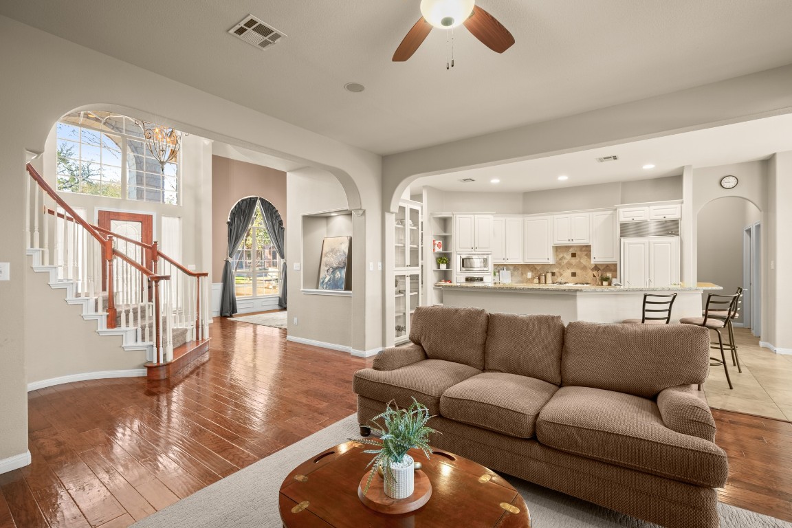8021 Tahoe Parke Circle Austin, TX 78726 - Photo 9 of 33 a living room with furniture fireplace and a large window