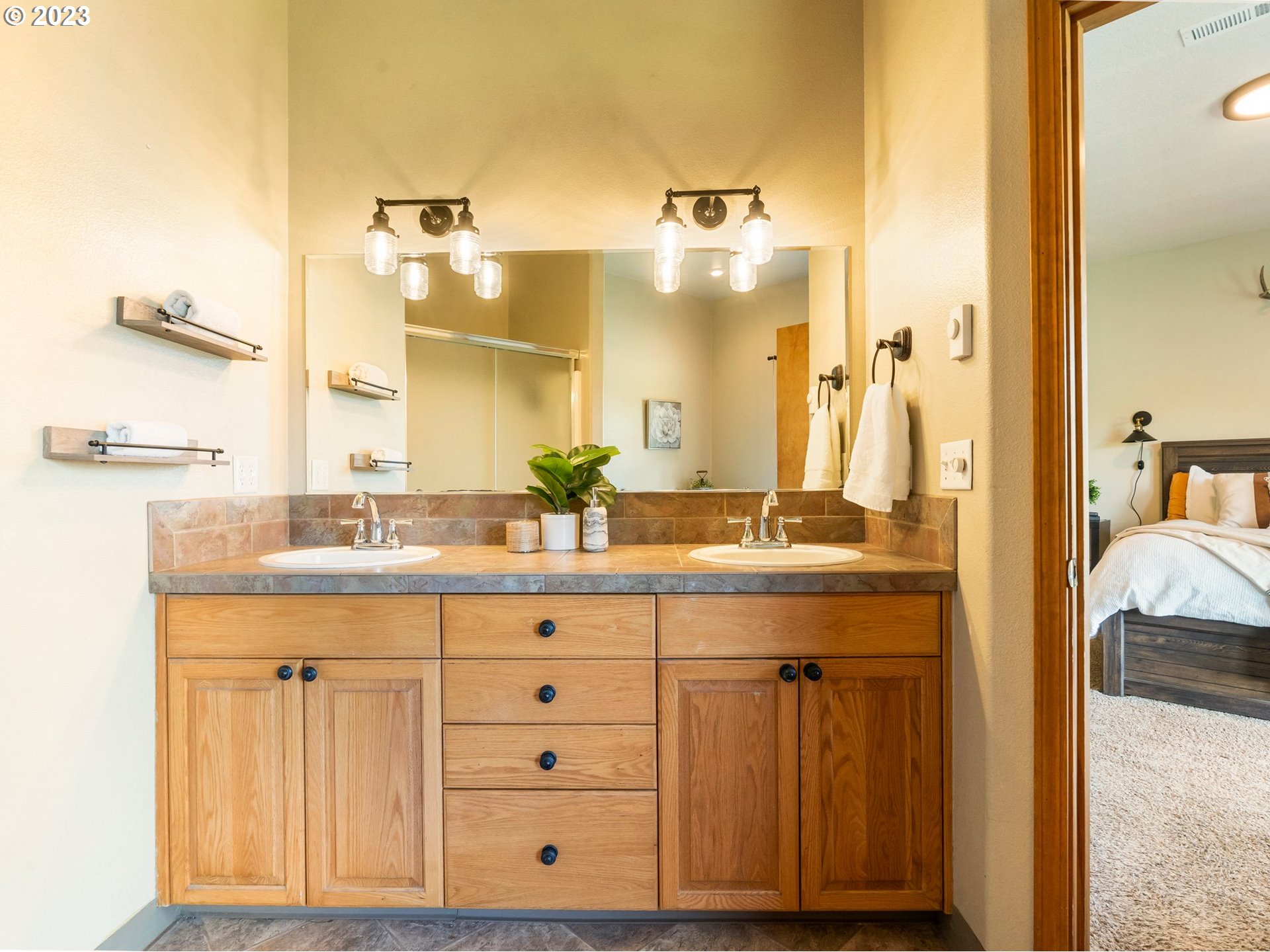 22114 Northeast 29th Avenue Ridgefield, WA 98642 - Photo 22 of 46 a bathroom with a granite countertop sink and a mirror