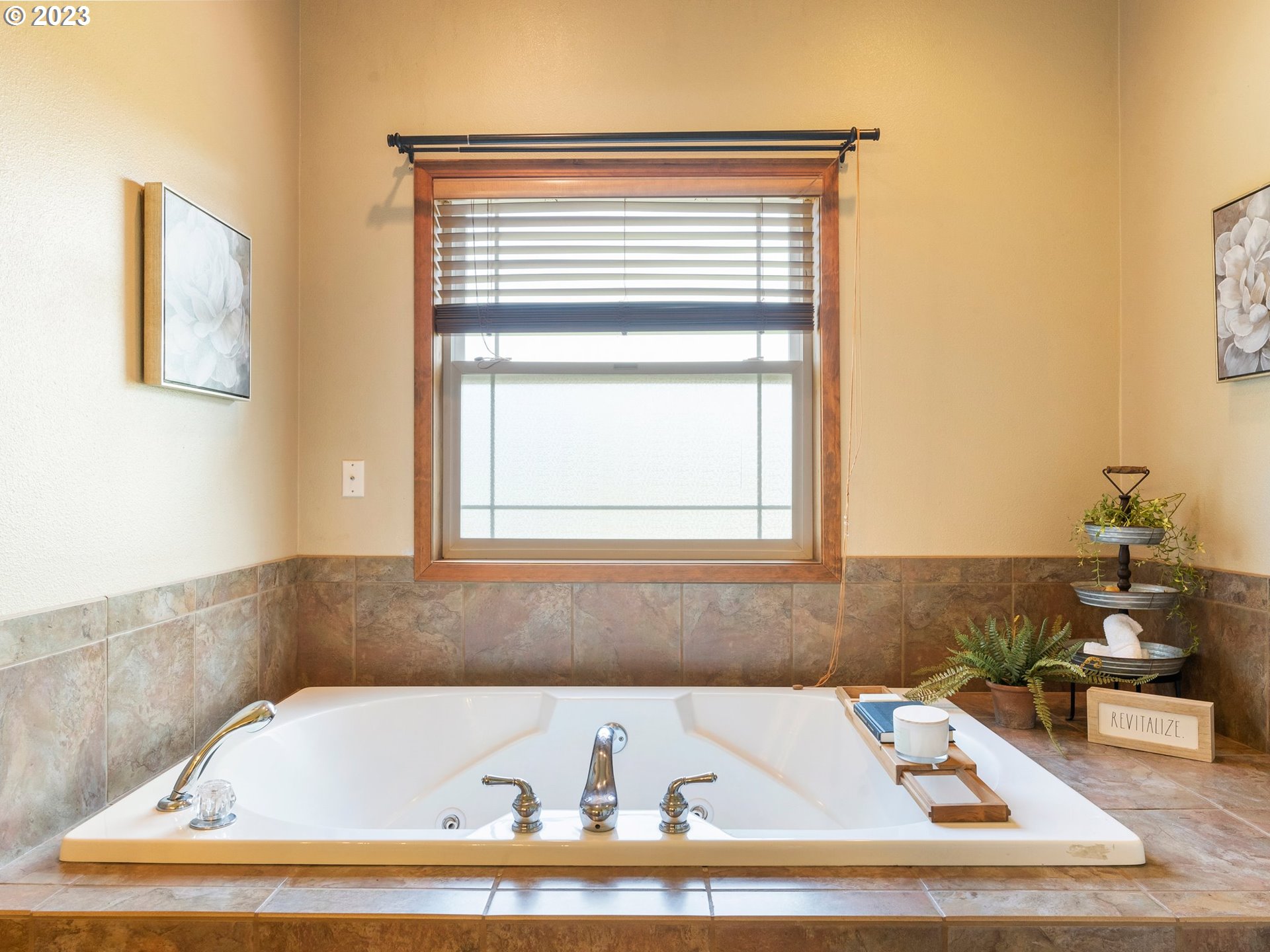 22114 Northeast 29th Avenue Ridgefield, WA 98642 - Photo 24 of 46 a bathroom with a bathtub and a window