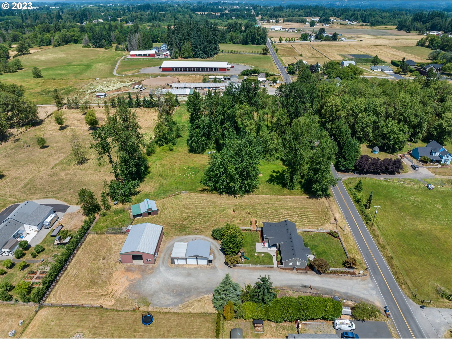 22114 Northeast 29th Avenue Ridgefield, WA 98642 - Photo 44 of 46 an aerial view of a house with outdoor space swimming pool and lake view