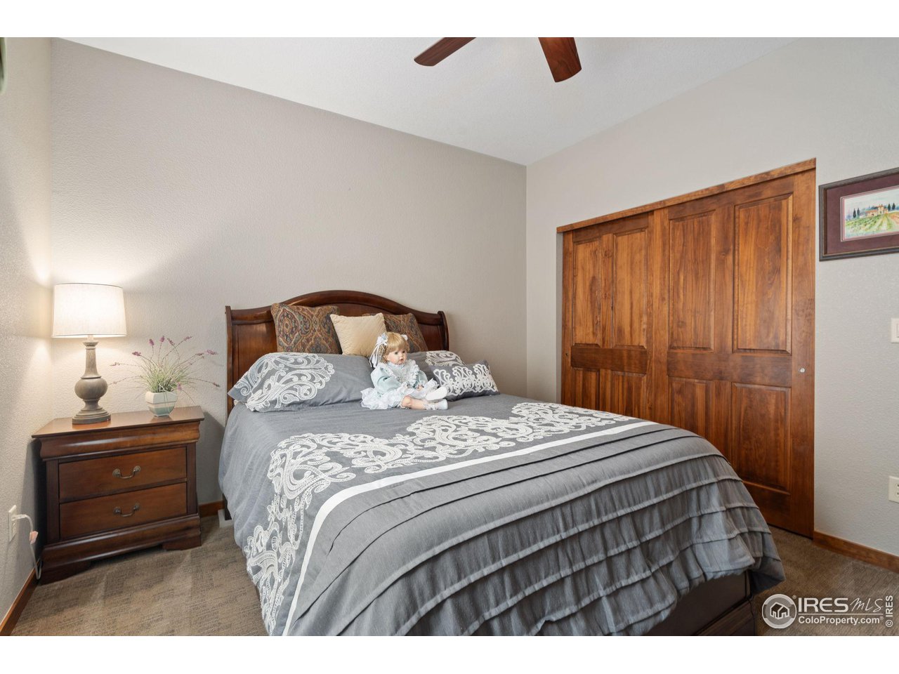 6564 Half Moon Bay Drive Windsor, CO 80550 - Photo 14 of 28 a bedroom with a bed and a closet