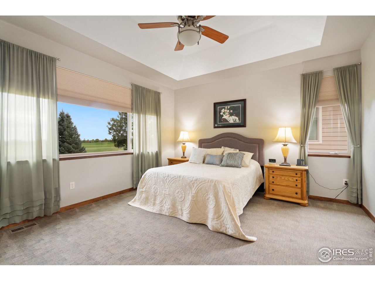 6564 Half Moon Bay Drive Windsor, CO 80550 - Photo 10 of 28 a bedroom with a large bed and a window