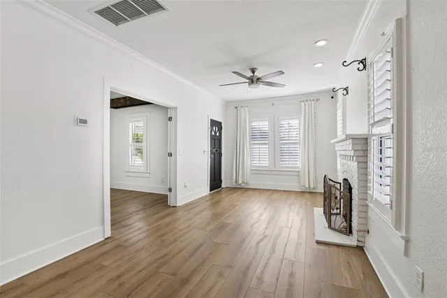 a view of livingroom with hardwood floor and a ceiling fan