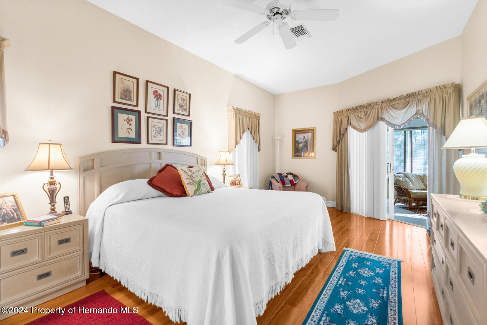 7424 Harvard Hills Place Spring Hill, FL 34606 - Photo 11 of 38 a bedroom with bed and window