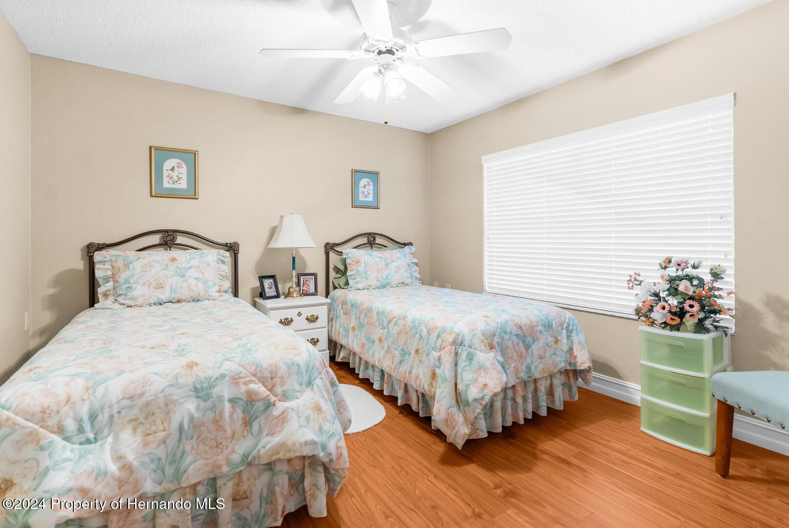 7424 Harvard Hills Place Spring Hill, FL 34606 - Photo 28 of 38 a bedroom with a bed and a window