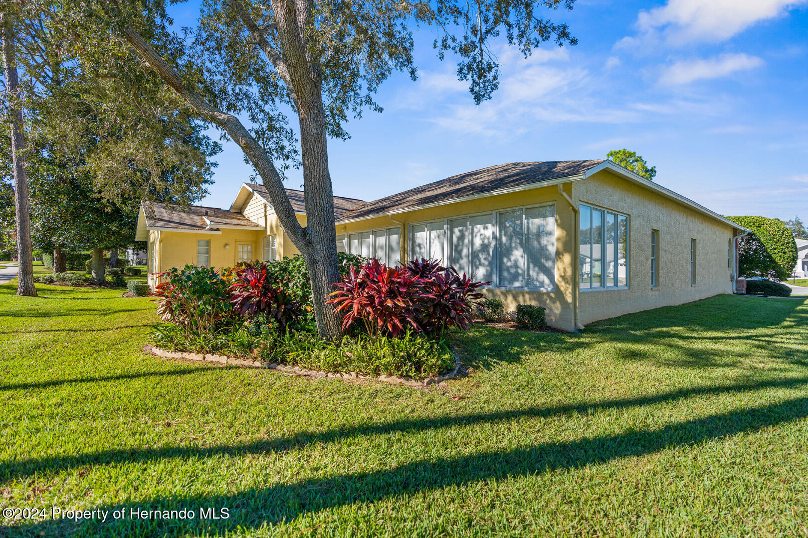 7424 Harvard Hills Place Spring Hill, FL 34606 - Photo 34 of 38 a front view of a house with a yard