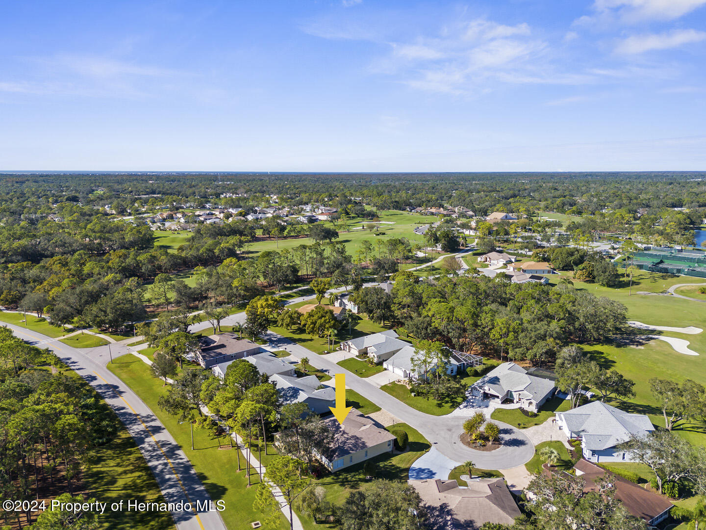 7424 Harvard Hills Place Spring Hill, FL 34606 - Photo 37 of 38 an aerial view of residential houses with outdoor space