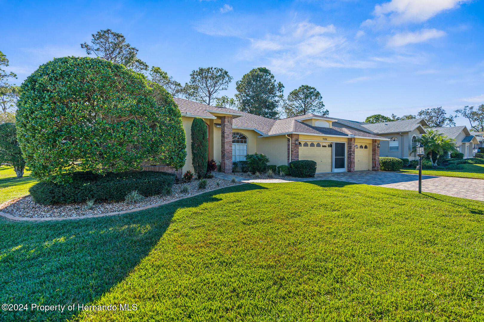 7424 Harvard Hills Place Spring Hill, FL 34606 - Photo 5 of 38 a view of a house with a swimming pool