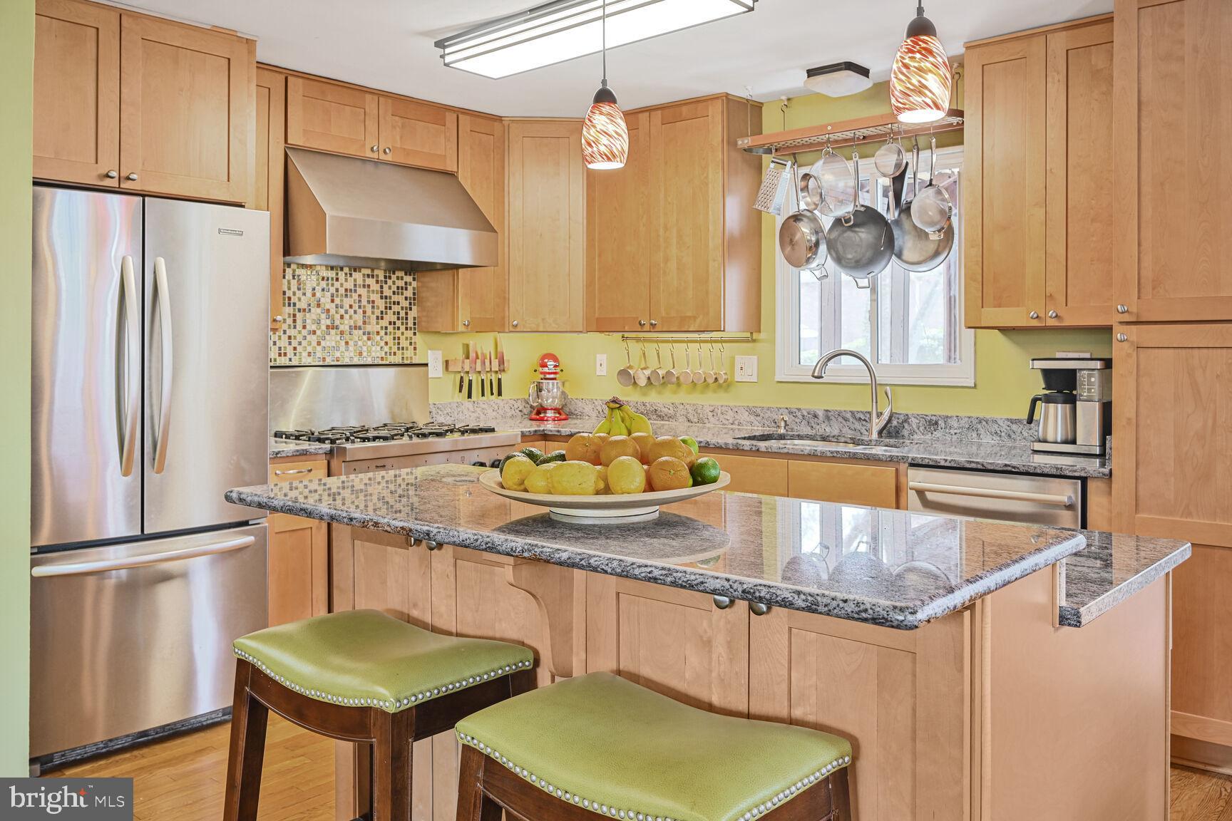 2308 Peggy Lane Silver Spring, MD 20910 - Photo 11 of 27 a kitchen with stainless steel appliances granite countertop a sink a stove and a refrigerator