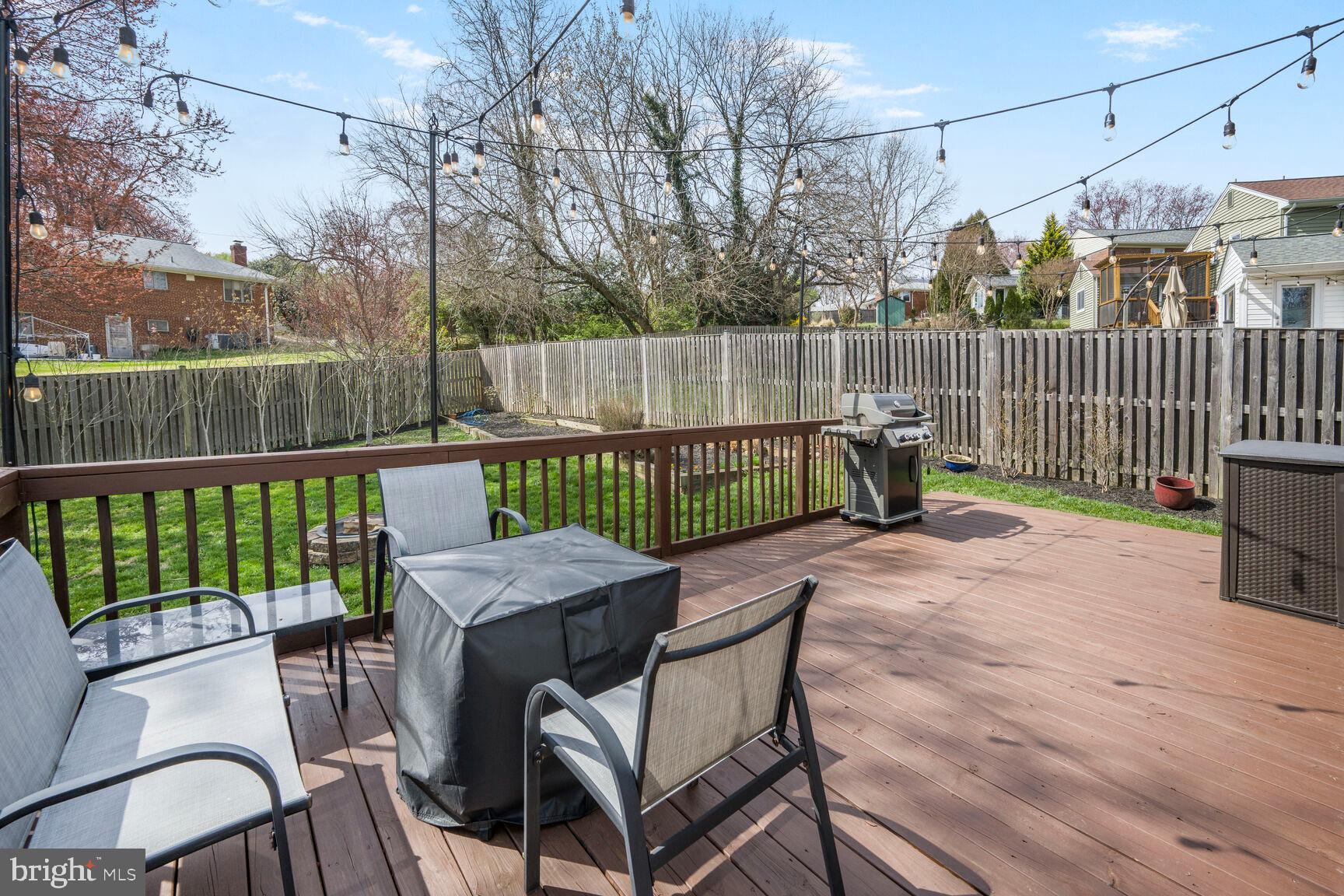 2308 Peggy Lane Silver Spring, MD 20910 - Photo 12 of 27 a view of a patio with a table chairs and a yard