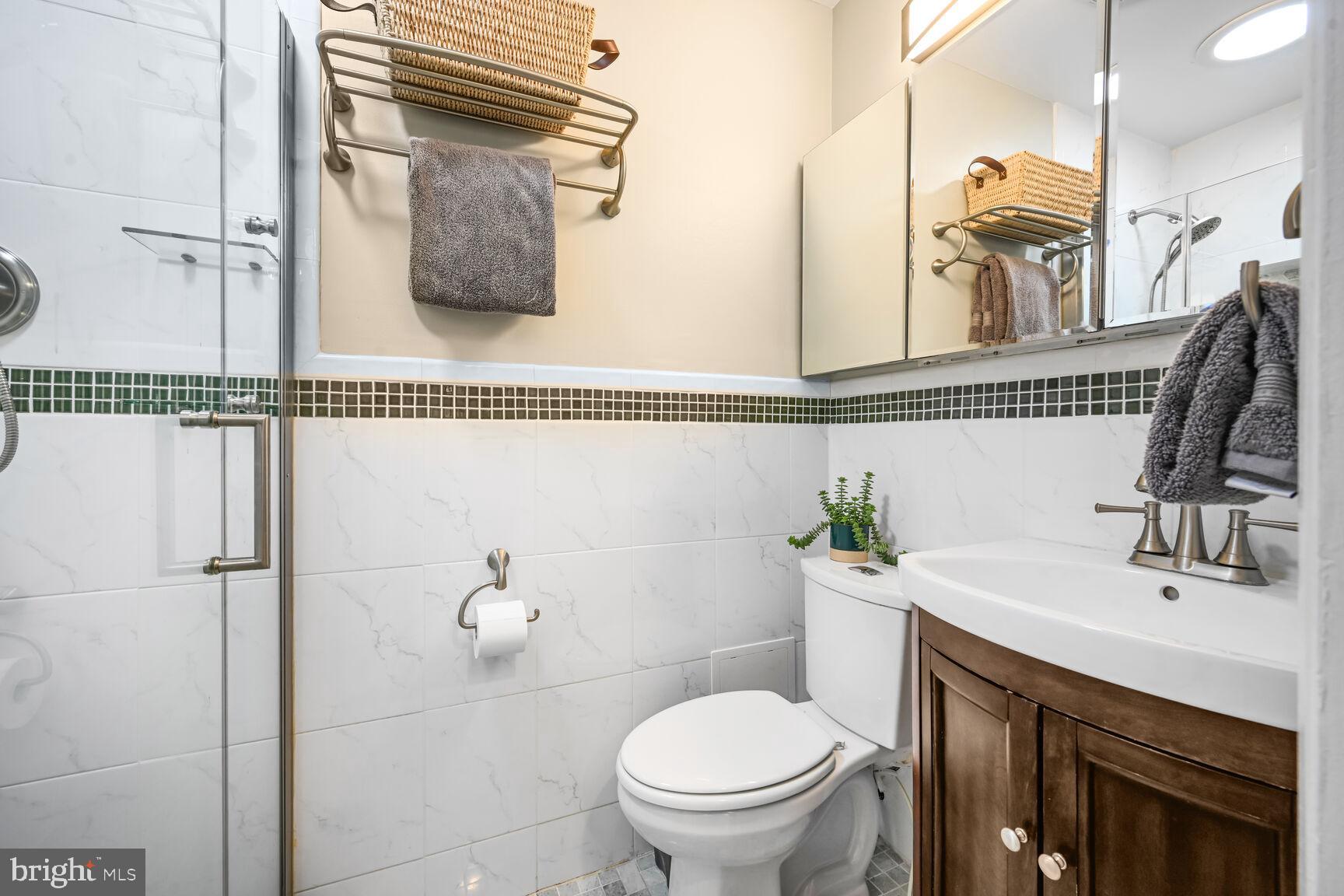2308 Peggy Lane Silver Spring, MD 20910 - Photo 15 of 27 a bathroom with a sink a toilet and shower