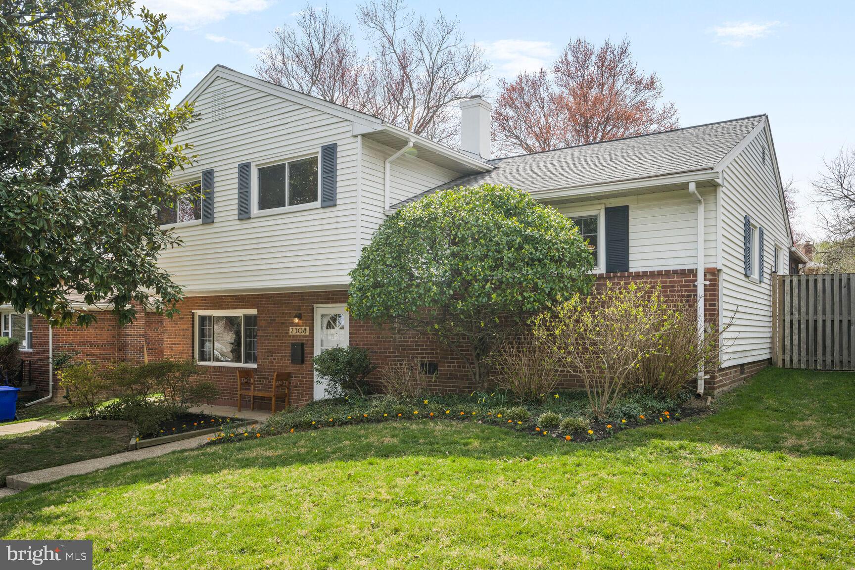 2308 Peggy Lane Silver Spring, MD 20910 - Photo 2 of 27 a view of a house with yard and a garden