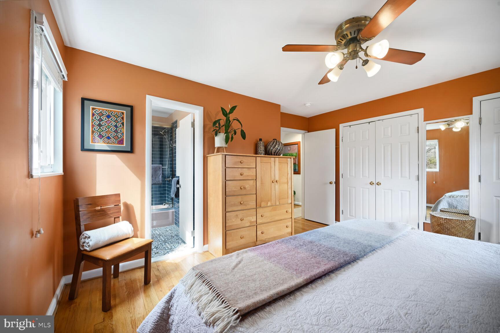2308 Peggy Lane Silver Spring, MD 20910 - Photo 21 of 27 a bedroom with a bed and a chandelier