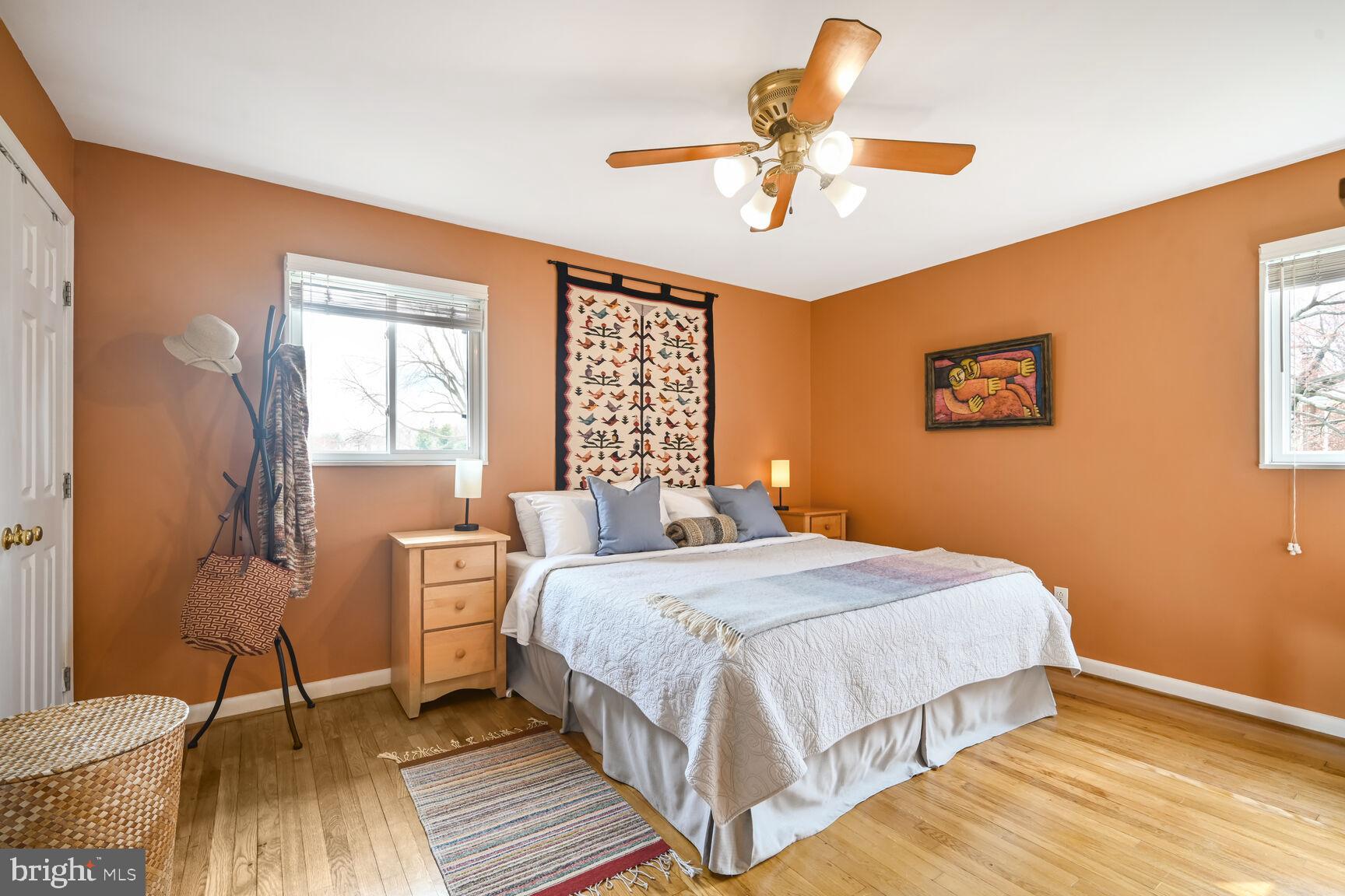2308 Peggy Lane Silver Spring, MD 20910 - Photo 22 of 27 a bedroom with a bed and wooden floor