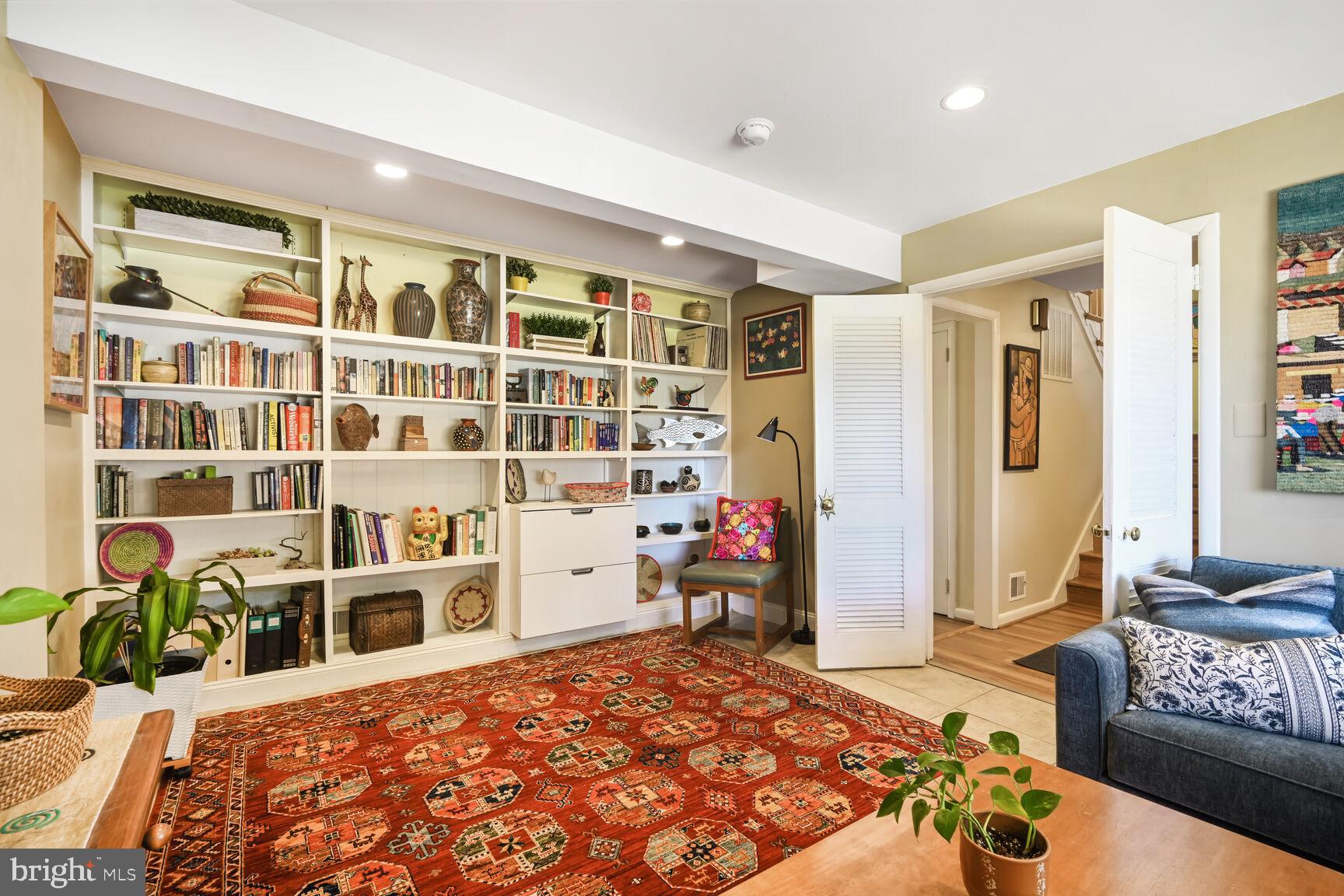 2308 Peggy Lane Silver Spring, MD 20910 - Photo 23 of 27 a bedroom with bed and a book shelf