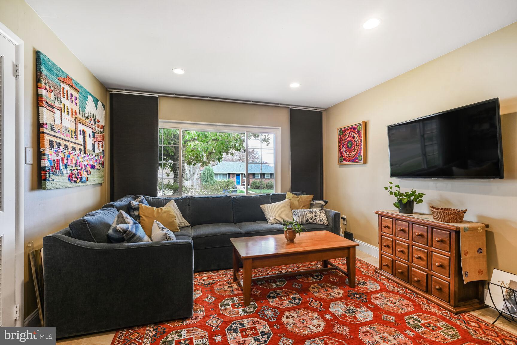 2308 Peggy Lane Silver Spring, MD 20910 - Photo 24 of 27 a living room with furniture and a flat screen tv