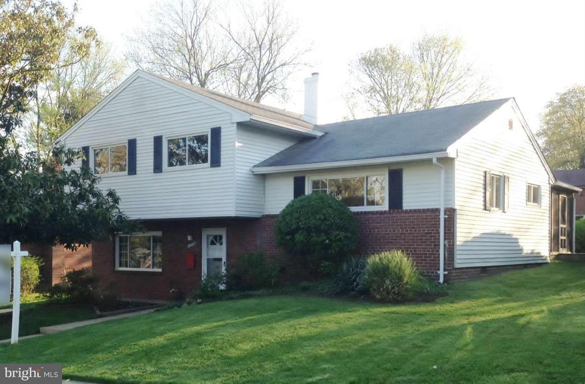 2308 Peggy Lane Silver Spring, MD 20910 - Photo 3 of 27 a front view of a house with a yard and garage