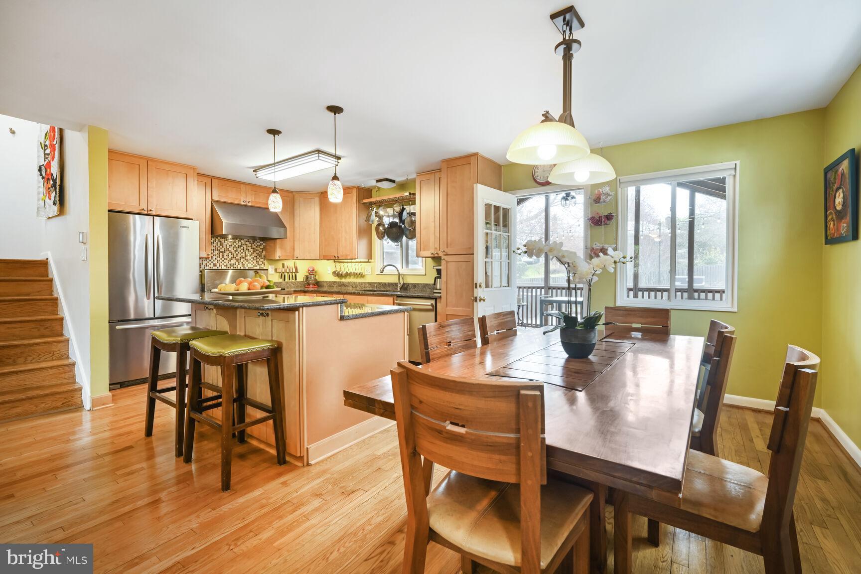 2308 Peggy Lane Silver Spring, MD 20910 - Photo 10 of 27 a dining room with furniture a chandelier and wooden floor