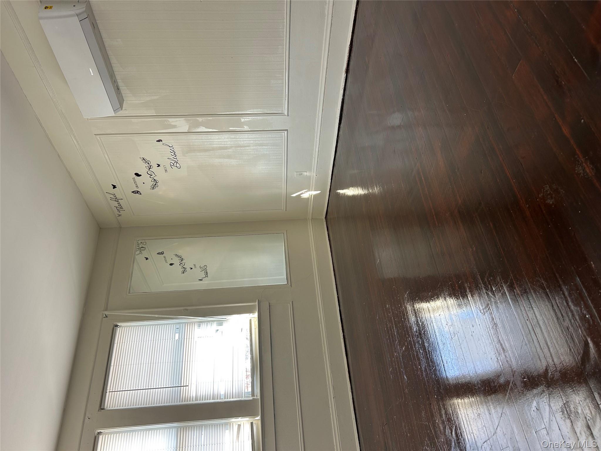139 Derby Street Valley Stream, NY 11581 - Photo 12 of 14 a view of empty room with wooden floor and fan