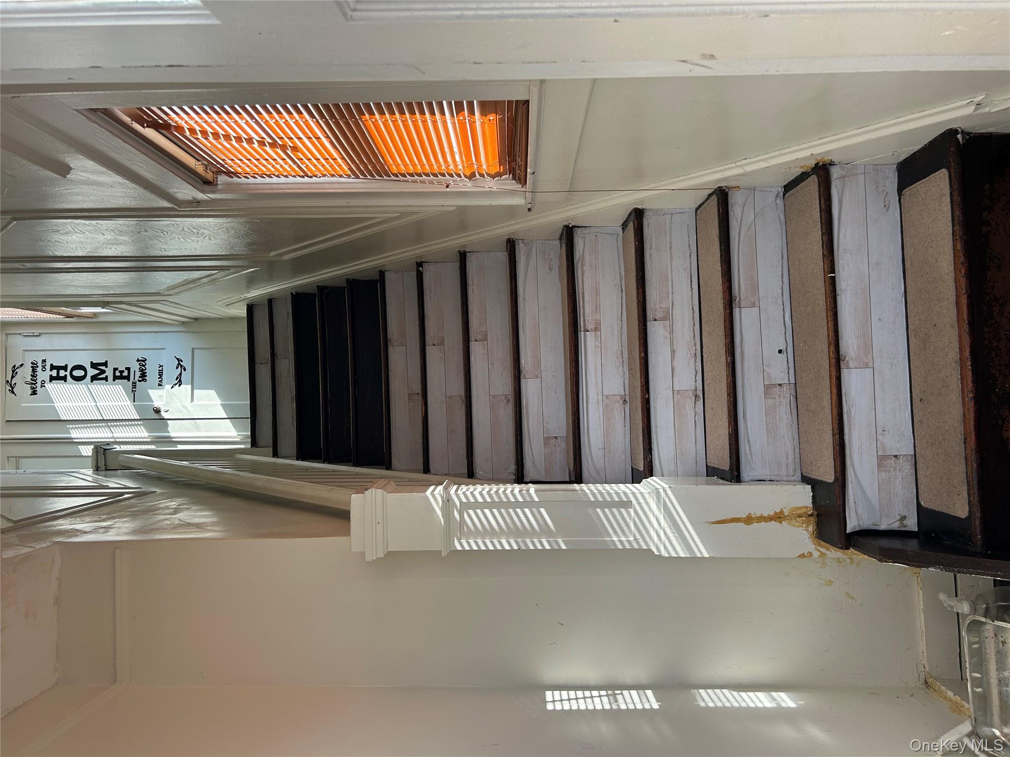 139 Derby Street Valley Stream, NY 11581 - Photo 3 of 14 a view of entryway and hall with wooden floor