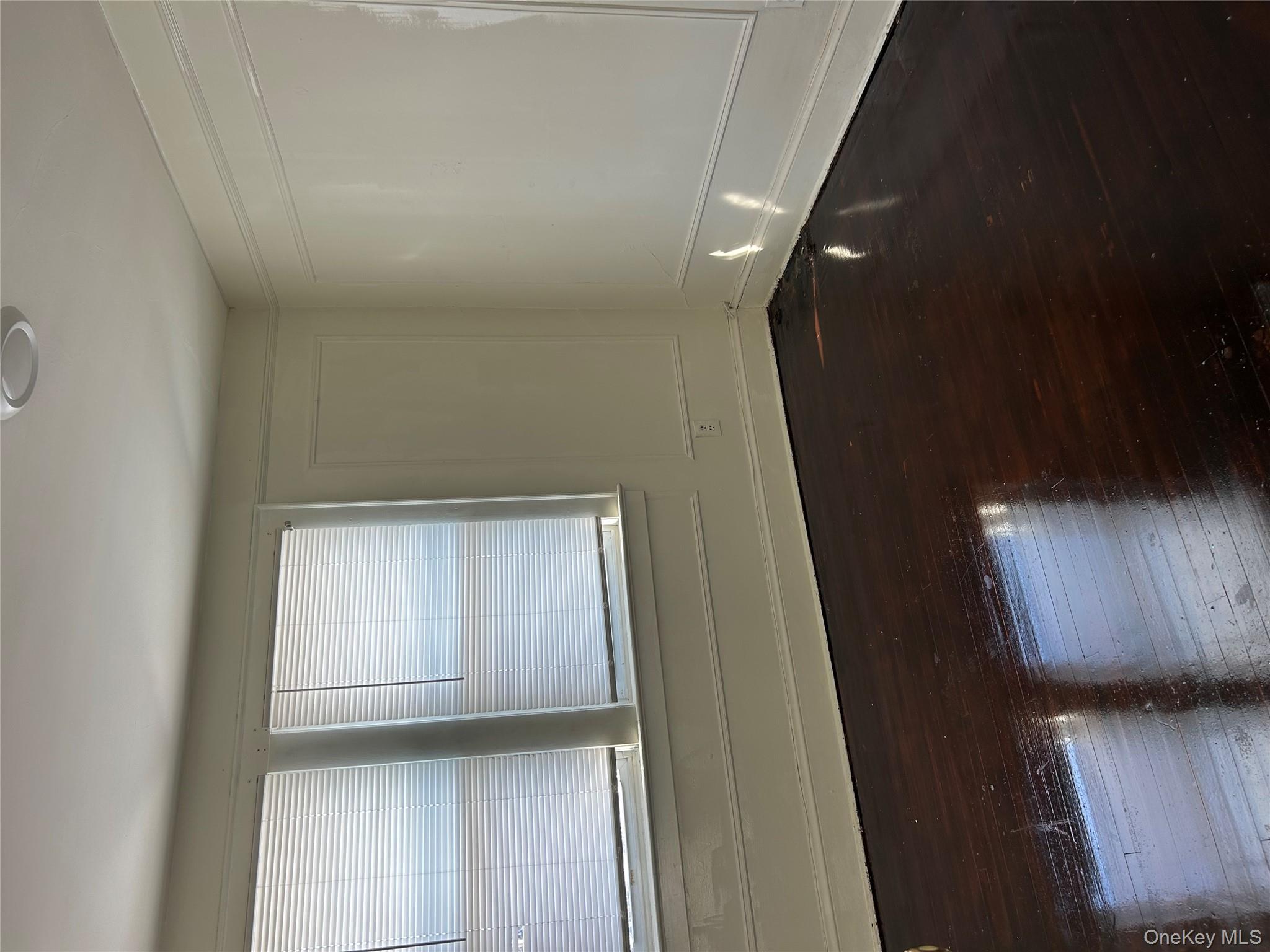 139 Derby Street Valley Stream, NY 11581 - Photo 4 of 14 a view of a room with wooden floor and a window