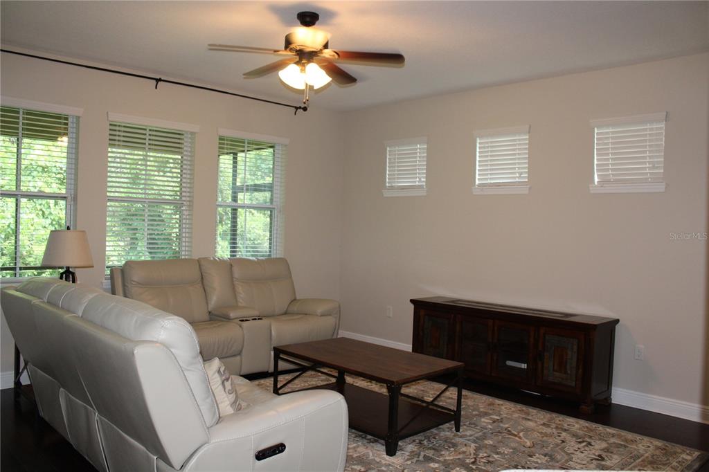 131 Villa Preserve Avenue Tampa, FL 33613 - Photo 13 of 28 a living room with furniture and a window