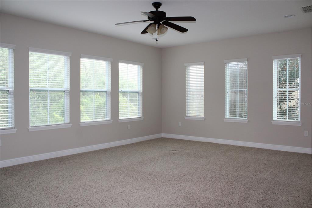 131 Villa Preserve Avenue Tampa, FL 33613 - Photo 28 of 28 a view of a livingroom with a ceiling fan and window