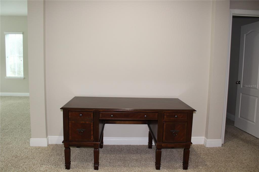 131 Villa Preserve Avenue Tampa, FL 33613 - Photo 3 of 28 a room with a table and a chair