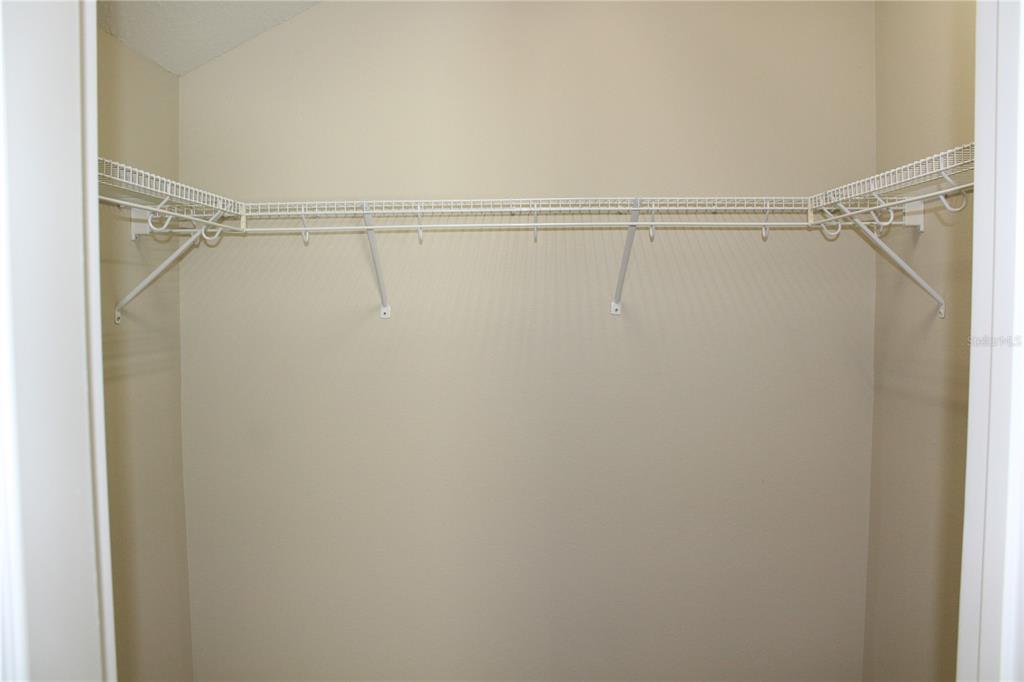 131 Villa Preserve Avenue Tampa, FL 33613 - Photo 5 of 28 a view of a room with racks on the wall