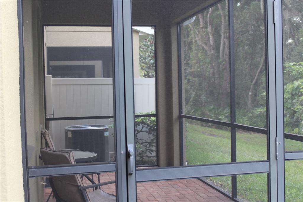 131 Villa Preserve Avenue Tampa, FL 33613 - Photo 8 of 28 a room that has a window and a table in it