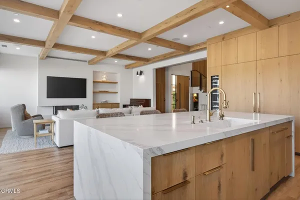 a living room with furniture a ceiling fan and a rug