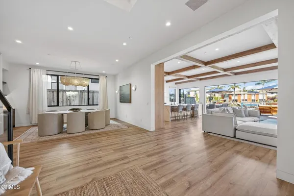 a kitchen with granite countertop white cabinets and stainless steel appliances