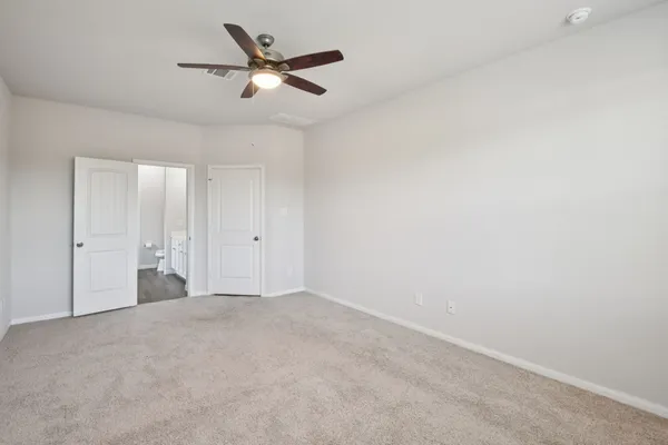 a view of a livingroom with a ceiling fan & a ceiling fan